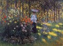 Mujer con sombrilla en el jardín en Argenteuil