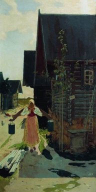 In the village. Girl with a bucket