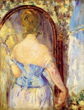 kvinna framför en spegel 1877