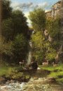 Eine Familie Hirsch in einer Landschaft mit Wasserfall