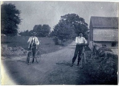 Benjamin Eakins and Samuel Murray with bicycles