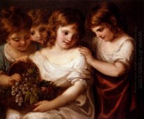 Quatro crianças com uma cesta do fruto