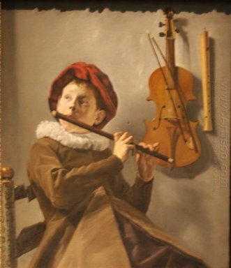 Pojke spela flöjt