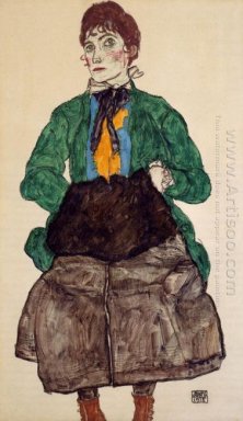 Vrouw in een groene blouse en (bijv. een gehoorkap 1915