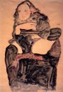 Ragazza seduta con la gamba sinistra sollevata 1911