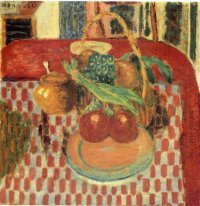Korb und Teller mit Früchten auf einem Red-karierte Tischdecke
