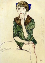 sentada mulher em uma blusa verde 1913