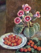 A flower in a pot and strawberries