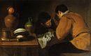 Twee jonge mannen Eten bij een bescheiden Tafel