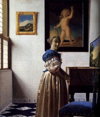 a lady standing at a virginal