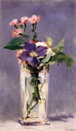 rosa och clematis i en crystal vas