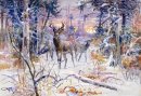 Herten in een besneeuwd bos