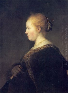 Una mujer joven en perfil con una fan 1632