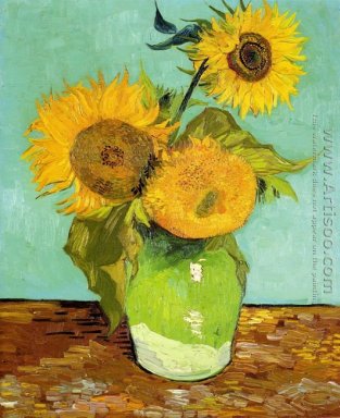 Drei Sonnenblumen in einer Vase