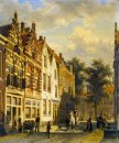 Figures in the Sunlit Streets of a Dutch Town