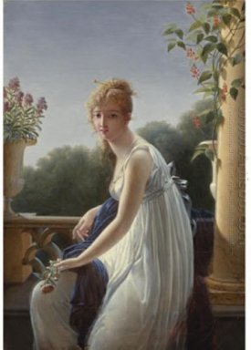 Una mujer joven sentada junto a una ventana