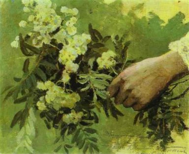 En hand med blommor