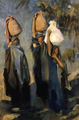 Beduini donne che trasportano giare