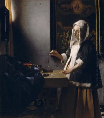 Mujer sosteniendo una balanza 1665